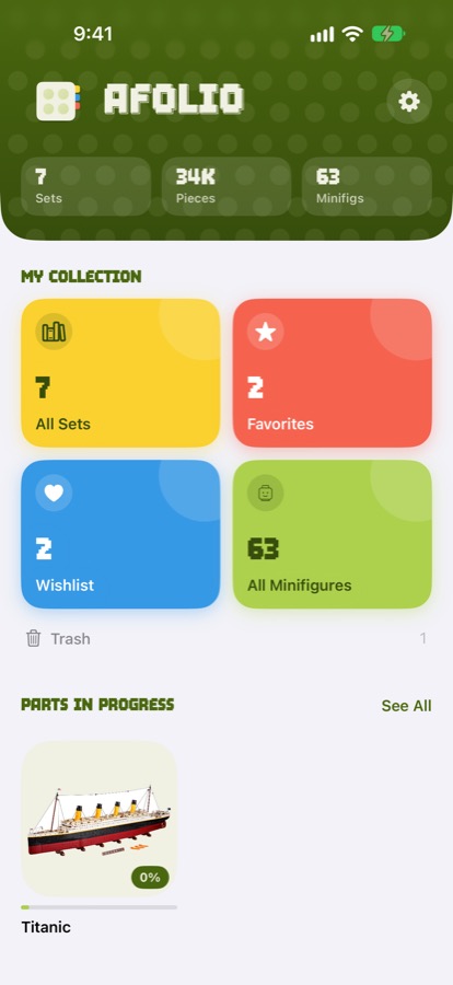 Afolio home screen on iPhone with collection totals, colourful tiles for sets, favourites, wishlist and minifigures, and Parts In Progress